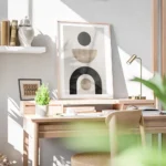 affiche avec formes abstraites noires et beiges sur fond gris beige typographie bureau.webp