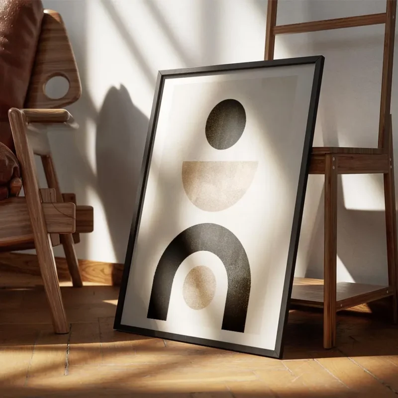 affiche avec formes abstraites noires et beiges sur fond gris beige typographie encadre.webp