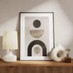 affiche avec formes abstraites noires et beiges sur fond gris beige typographie meuble.webp