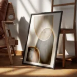 affiche avec formes aquarelles beiges marron et noires separees par des lignes d encadre.webp