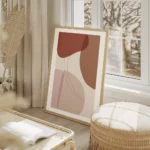 affiche avec formes graphiques abstraites et lignes courbes en tons de rose et r salon beige.webp