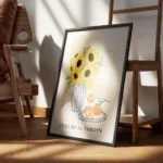 affiche avec illustration de tournesols dans un vase raye et doranges sur une as encadre.webp