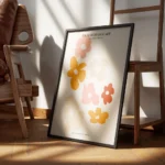 affiche avec illustration graphique de fleurs decoupees roses orange et beiges s encadre.webp