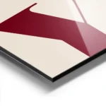 affiche avec le mot joy en grandes lettres rouges typographie serif sur un fond aluminium.webp