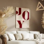affiche avec le mot joy en grandes lettres rouges typographie serif sur un fond salon.webp