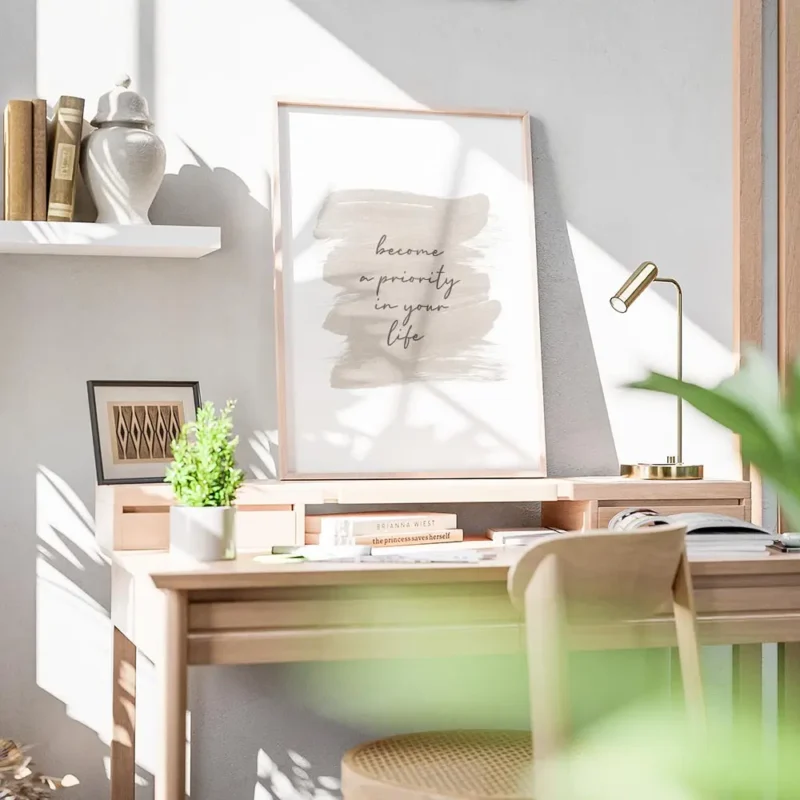 affiche avec le texte become a priority in your life en typographie noire sur un bureau.webp
