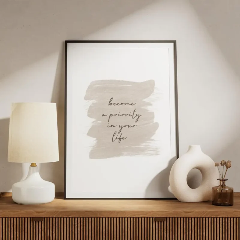 affiche avec le texte become a priority in your life en typographie noire sur un meuble.webp