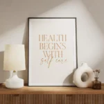 affiche avec le texte health begins with self care en orange sur fond beige clai meuble.webp