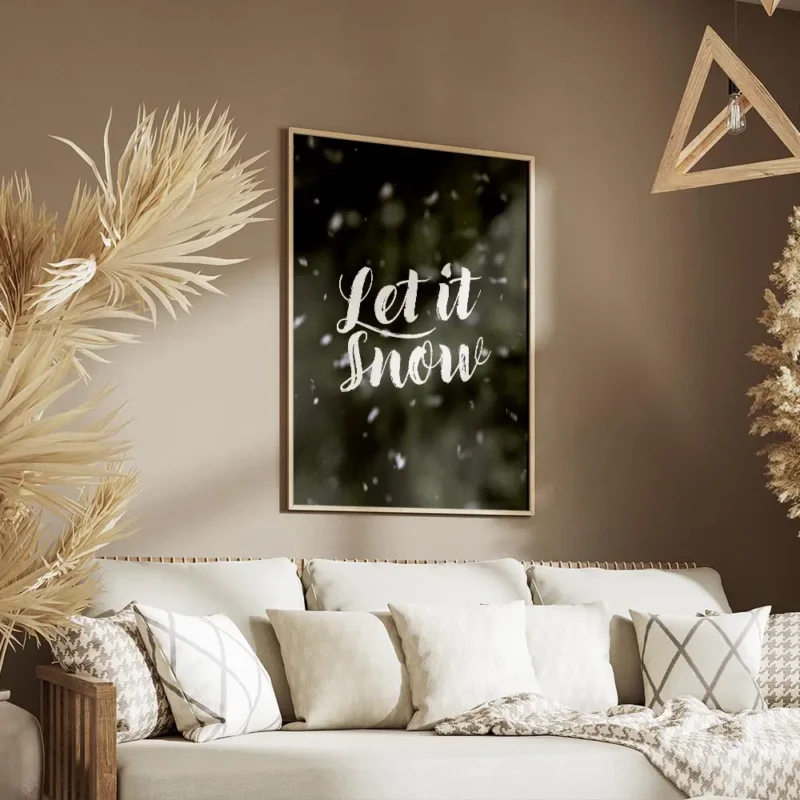 affiche avec le texte let it snow en typographie blanche manuscrite sur un fond salon.webp