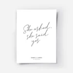 affiche avec le texte she asked she said yes en typographie manuscrite noire sur.webp