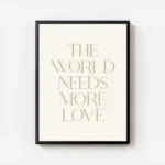 affiche avec le texte the world needs more love en typographie serif verte sur f avec cadre.webp