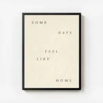 affiche avec les mots some days feel like home en lettres marron sur fond beige avec cadre.webp