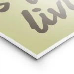 affiche avec les mots this life is for living en marron sur fond vert pale et un lightpanel.webp