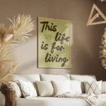 affiche avec les mots this life is for living en marron sur fond vert pale et un salon.webp
