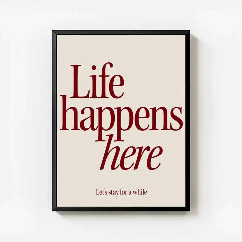 affiche avec linscription life happens here en rouge fonce et lets stay for a wh avec cadre.webp