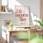 affiche avec linscription life happens here en rouge fonce et lets stay for a wh bureau.webp