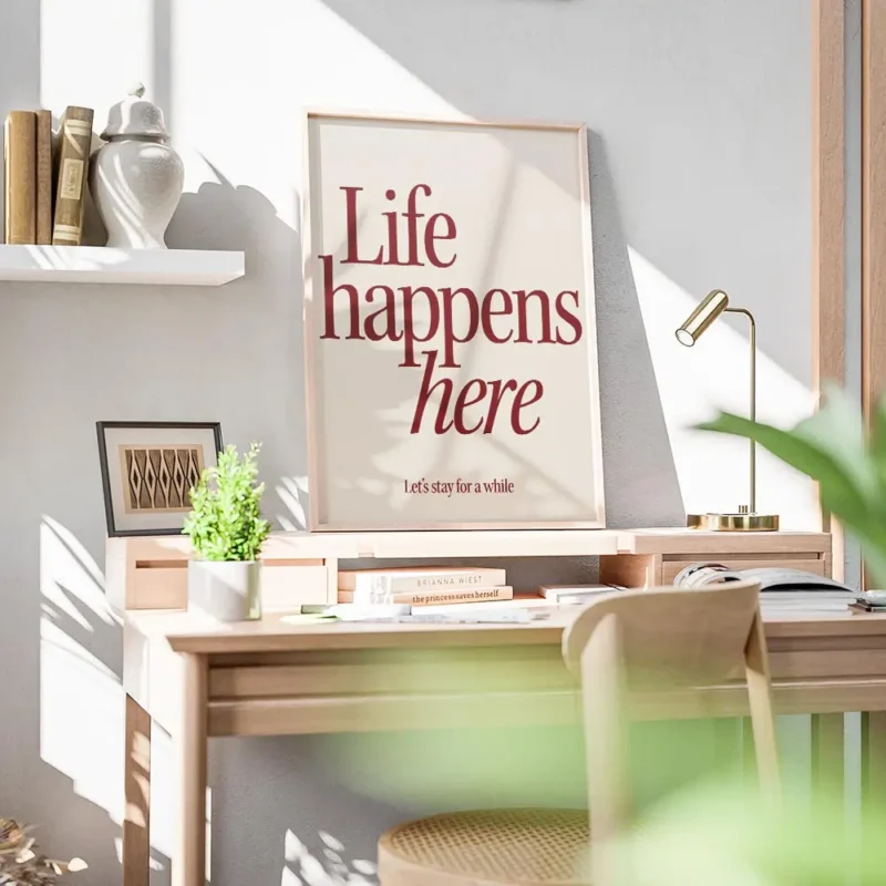 affiche avec linscription life happens here en rouge fonce et lets stay for a wh bureau.webp