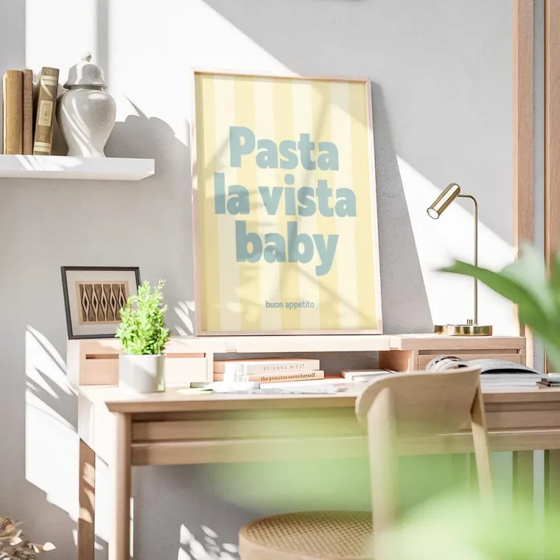 affiche avec linscription pasta la vista baby en bleu sur fond raye jaune clair bureau.webp
