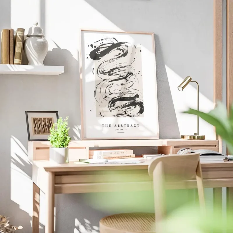 affiche avec peinture abstraite noire sur fond beige et typographie the abstract bureau.webp