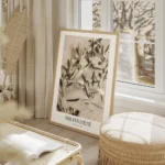 affiche avec photographie dolives vertes sur des branches dolivier sur un fond e salon beige.webp