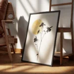 affiche avec silhouettes de fleurs noires sur fond beige un soleil jaune en arri encadre.webp