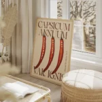 affiche avec trois piments rouges coupes en deux et leurs graines sur fond beige salon beige.webp