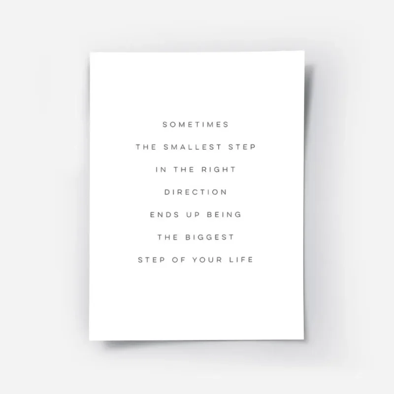 affiche avec typographie noire sur fond blanc citant sometimes the smallest step.webp