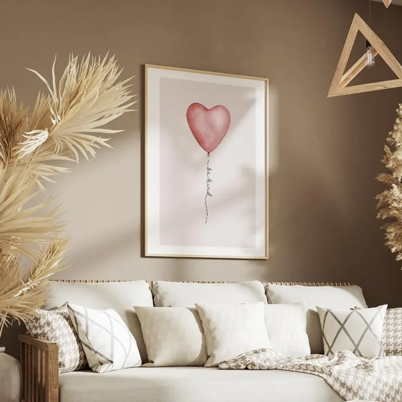 affiche avec un ballon rose en forme de c ur et le texte be kind en typographie salon.webp