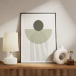 affiche avec un cercle vert fonce et une arche verte claire sur un fond blanc de meuble.webp