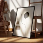 affiche avec un design abstrait de lignes noires et de formes beiges blanches et encadre.webp