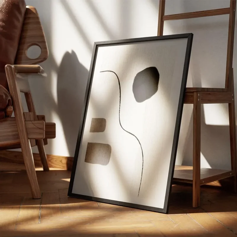 affiche avec un design abstrait de lignes noires et de formes beiges blanches et encadre.webp
