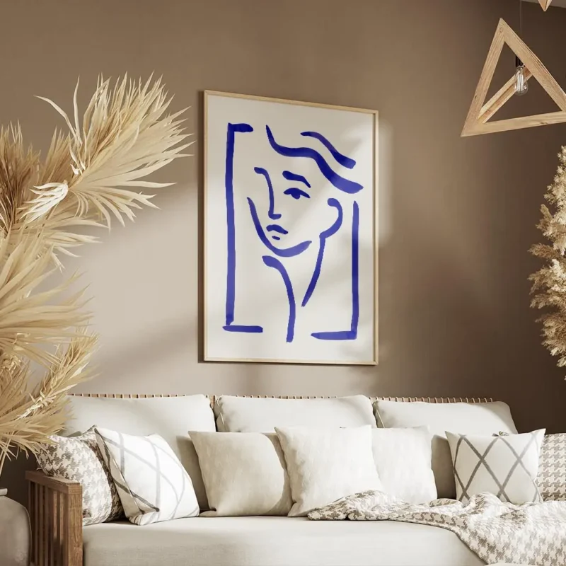 affiche avec un dessin de visage abstrait en lignes bleues sur fond clair style salon.webp