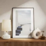 affiche avec un escalier bleu menant a une terrasse blanche surplombant la mer e meuble.webp