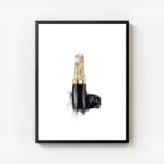 affiche avec un rouge a levres chanel rose pale et dore sur fond blanc avec une avec cadre.webp