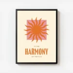 affiche avec un soleil orange sur un carre rose et le texte in the harmony of th avec cadre.webp
