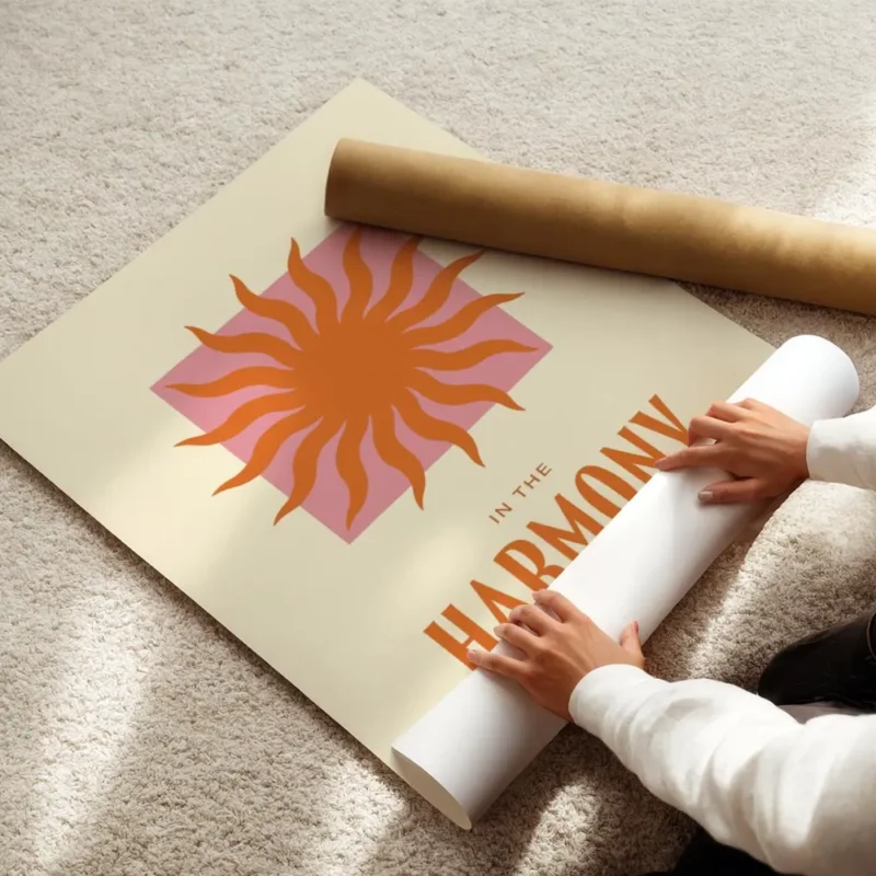 affiche avec un soleil orange sur un carre rose et le texte in the harmony of th enroule.webp
