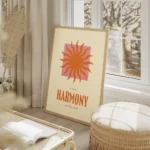 affiche avec un soleil orange sur un carre rose et le texte in the harmony of th salon beige.webp