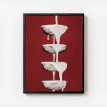 affiche avec une cascade de creme blanche versee sur des coupes a champagne arge avec cadre.webp