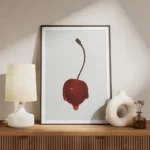 affiche avec une cerise rouge vif recouverte de sirop brillant sur fond gris cla meuble.webp
