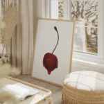 affiche avec une cerise rouge vif recouverte de sirop brillant sur fond gris cla salon beige.webp