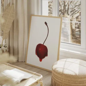 affiche avec une cerise rouge vif recouverte de sirop brillant sur fond gris cla salon beige.webp