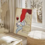 affiche avec une femme buvant du vin en robe rouge et lingerie bleue avec des ra salon beige.webp
