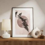 affiche avec une feuille de fougere noire devant un cercle rose fonce sur fond r meuble.webp