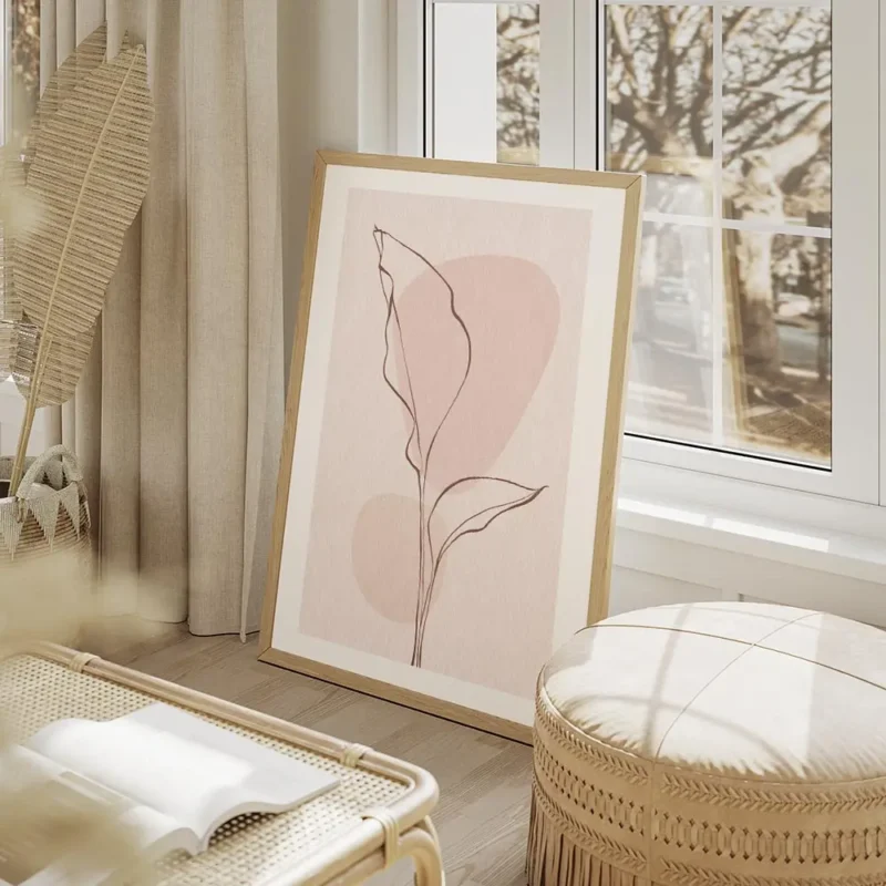 affiche avec une feuille rose en line art sur fond rose texture avec deux cercle salon beige.webp