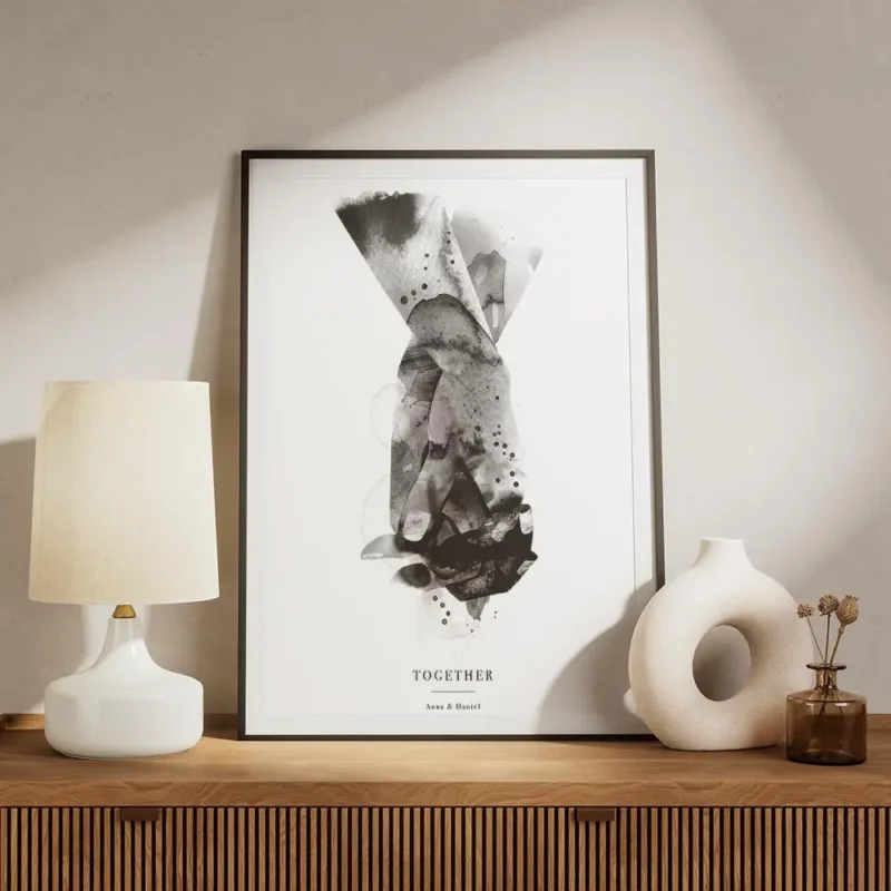 affiche avec une illustration aquarelle de deux mains entremelees en noir gris e meuble.webp
