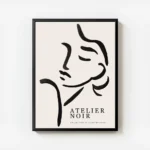 affiche avec une illustration de line art dun visage feminin abstrait en noir su avec cadre.webp
