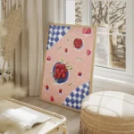 affiche avec une nature morte de cerises rouges et de petales sur une nappe rose salon beige.webp