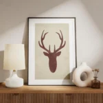 affiche avec une silhouette de cerf rouge sur fond beige typographie aquarelle f meuble.webp