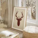 affiche avec une silhouette de cerf rouge sur fond beige typographie aquarelle f salon beige.webp