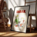 affiche babar et sa famille reine celeste pom flora et alexandre lisant un livre encadre.webp